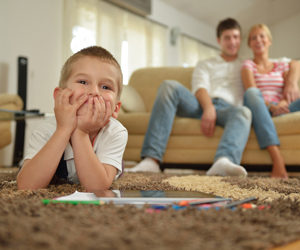 happy young family with kids in bright modern living room have f